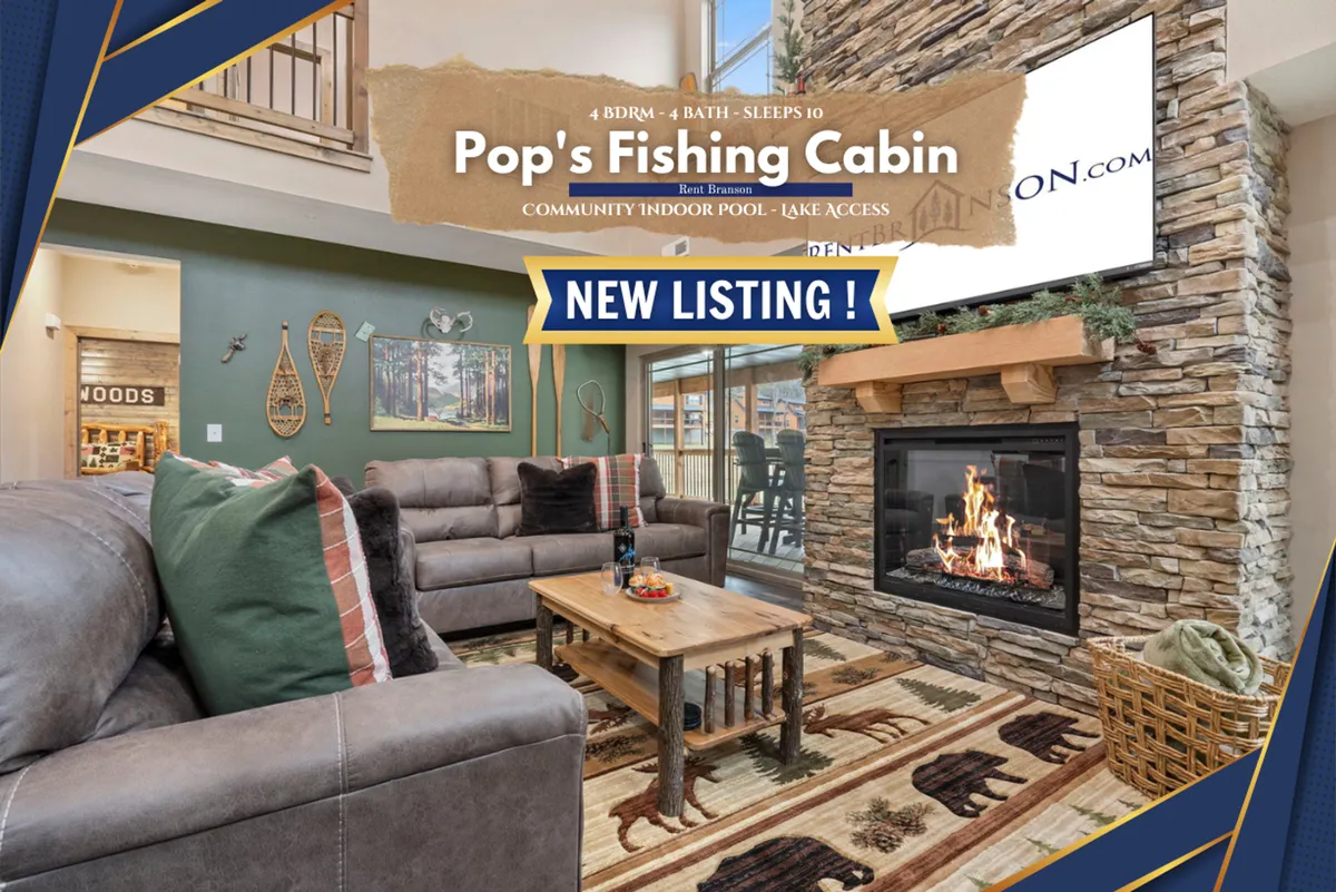 A comfortable living room corner featuring a stone fireplace, plush seating, large windows, and decorative artwork. The ambiance is warm and welcoming, ideal for snuggling up for movie marathons or sharing stories after a day outdoors.